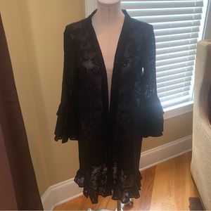 NWT Black Duster that is cool with a nice pattern and ruffled ends on sleeve.